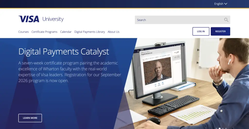 Visa University homepage featuring a professional working at a computer desk, promoting the "Digital Payments Catalyst" certificate program as part of its Fraud Prevention Training and Certifications offerings.