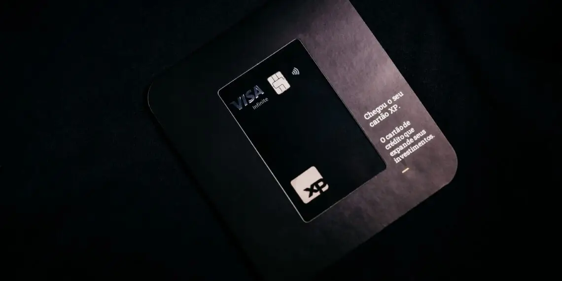A black Visa Infinite card on its mailer, illustrating the Visa network at the center of its penalty against Hims & Hers over chargeback disputes