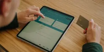 Person entering credit card details on a tablet to complete an online money transfer, illustrating the card-not-present transactions that make eCommerce fraud prevention essential for online merchants.