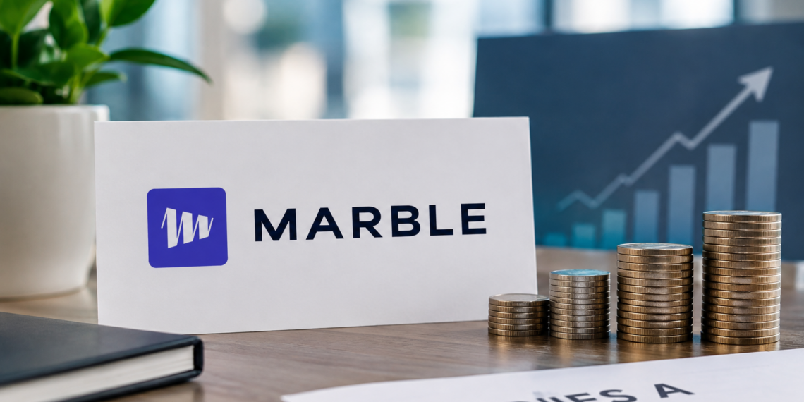 Marble logo sign beside a placard reading 'Series A €6.5M ($7.3M)' with stacks of gold coins on an office desk.
