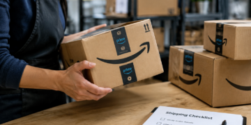 Stock photo of a worker holding an Amazon Prime package beside a stack of similar boxes on a shelf, with a “Shipping Checklist” clipboard in the foreground listing steps to verify order details, check for tampering, confirm customer information, and log the tracking number.