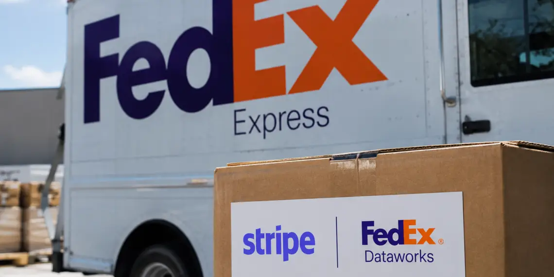 Stock photo of a FedEx Express delivery truck with a cardboard box in the foreground bearing a "Stripe | FedEx Dataworks" label, illustrating a partnership between the two companies.